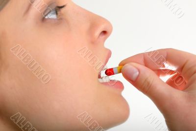 Woman taking pills