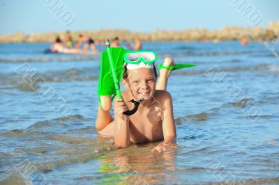 boy in the sea on a beach