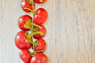 Red chilli in a row, tied by rope