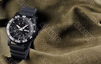 military watch on sack background