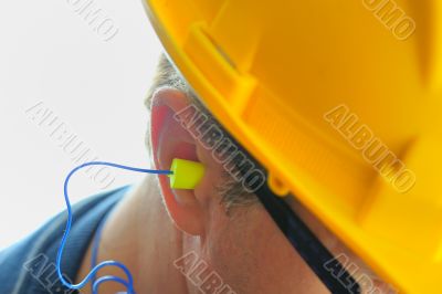 yellow earplug into the ear