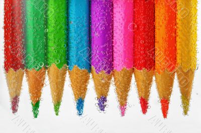 colored pencils sunken in water