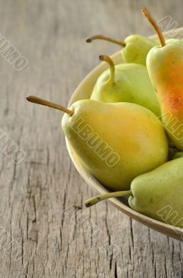 Fresh pears in bowl 