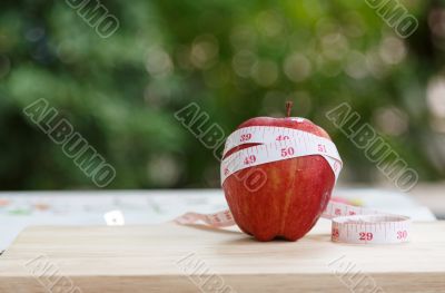 red Apple and measuring tape 