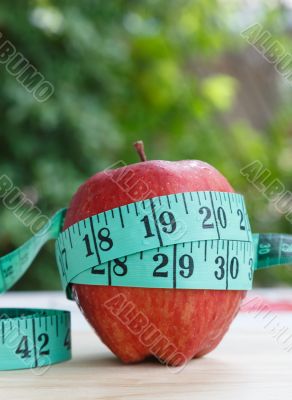 Apple and measuring tape 