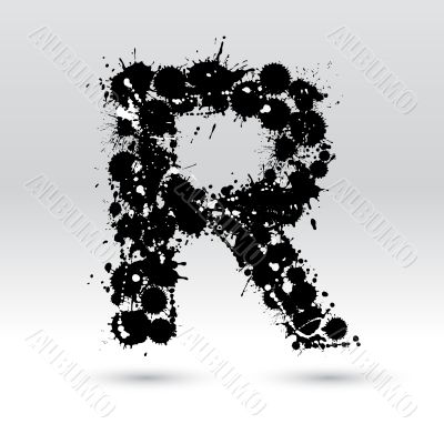 Letter R formed by inkblots