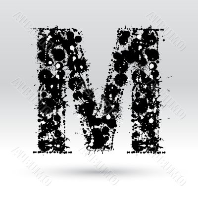 Letter M formed by inkblots