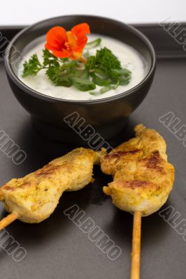 Chicken skewers and bowl
