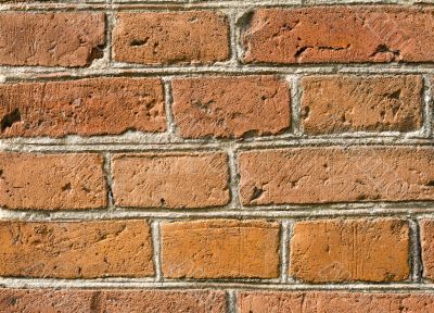 Fragment of a brick wall of an ancient building.