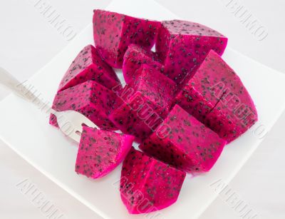 dragon fruits and  slice on plate 