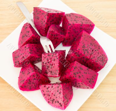 dragon fruits and  slice on plate 