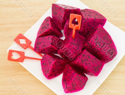 dragon fruits and  slice on plate 