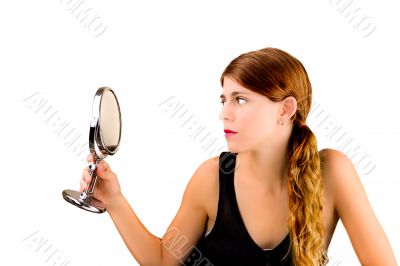 Checking herself in the mirror