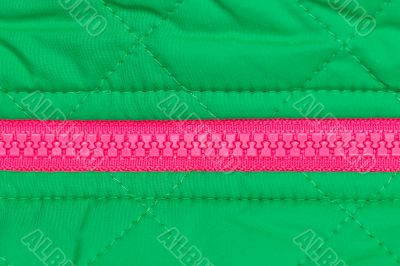 pink zipper on the green fabric