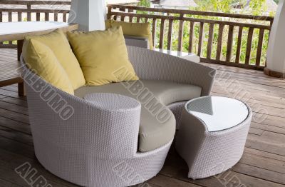 wicker sofa with pillow
