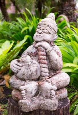 Thai religious statue in the green