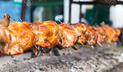 grilled chicken roasted on a spit