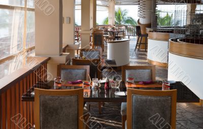 Table and chairs in empty cafe