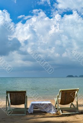 sun chairs on tropical beach