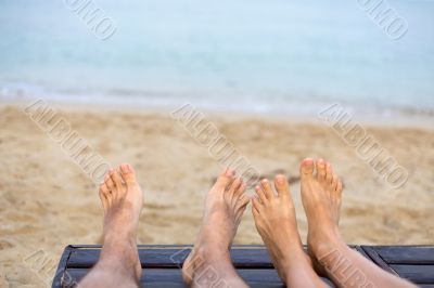feet are on the beach