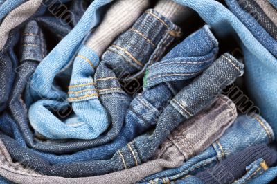 stack of various jeans