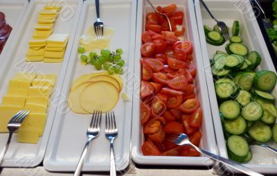 vegetables and cheese on the trays