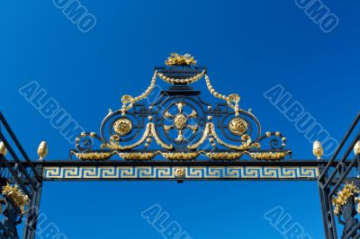 Detail of the gate against the blue sky