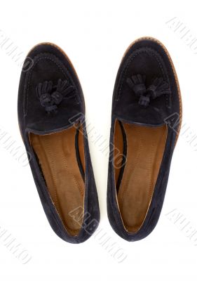 Pair of blue female shoes over white, view from above
