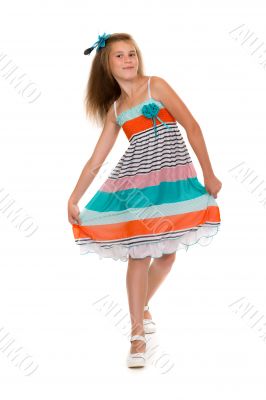 dancing girl in a dress in the studio