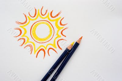 Hand drawing sun with pencils