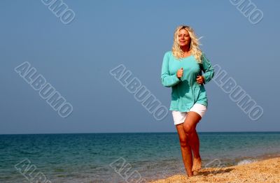 Woman running at the beach