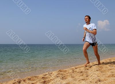 Man running against the sea