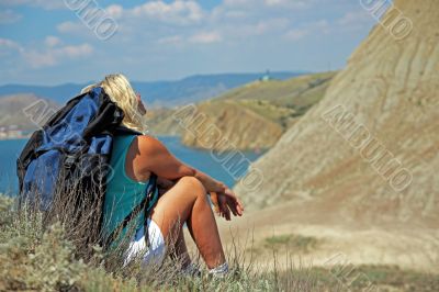 Girl looking at the mountains and the sea