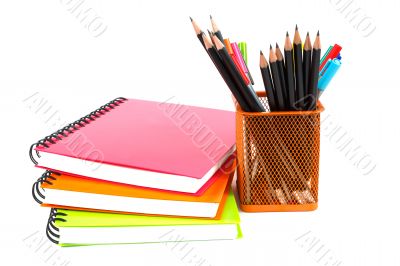 notebook and pencils on white background 