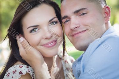 Mixed Race Romantic Couple Portrait in the Park
