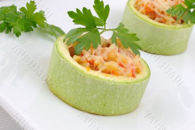 Zucchini stuffed with vegetables with rice and cheese