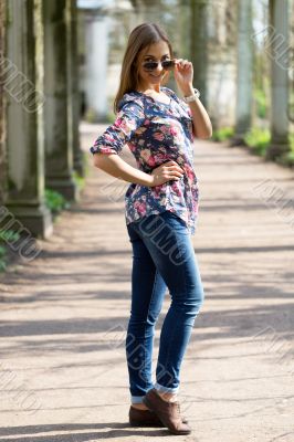 beautiful young woman in full length in sunglasses