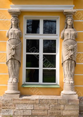 window with sculptures