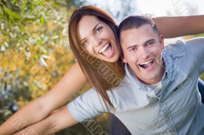 Mixed Race Romantic Couple Portrait in the Park