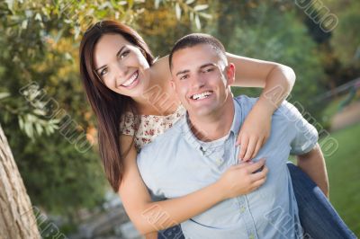 Happy Mixed Race Romantic Couple Portrait in the Park