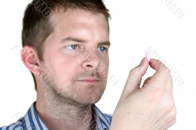 Man holding a Pill