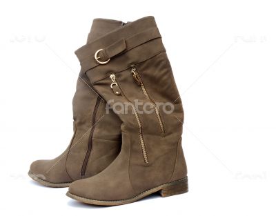 Women`s boots made of soft skin on a white background.