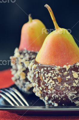 two fresh pear with chocolate icing 