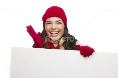 Thrilled Girl Wearing Winter Hat and Gloves Holds Blank Sign 