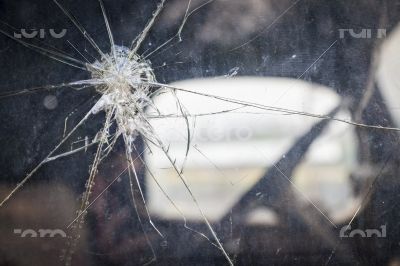 Cracked Window Glass on Antique Truck Abstract

