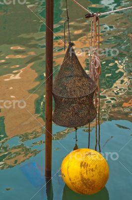 Venice Italy fishing gear on canal