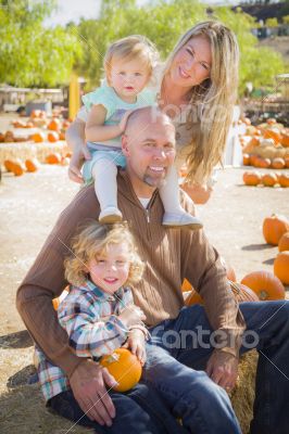 Attractive Family Portrait at the Pumpkin Patch