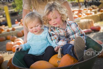 Young Family Enjoys a Day at the Pumpkin Patch