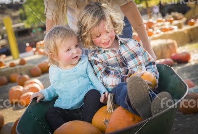 Young Family Enjoys a Day at the Pumpkin Patch