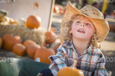 Little Boy in Cowboy Hat at Pumpkin Patch
